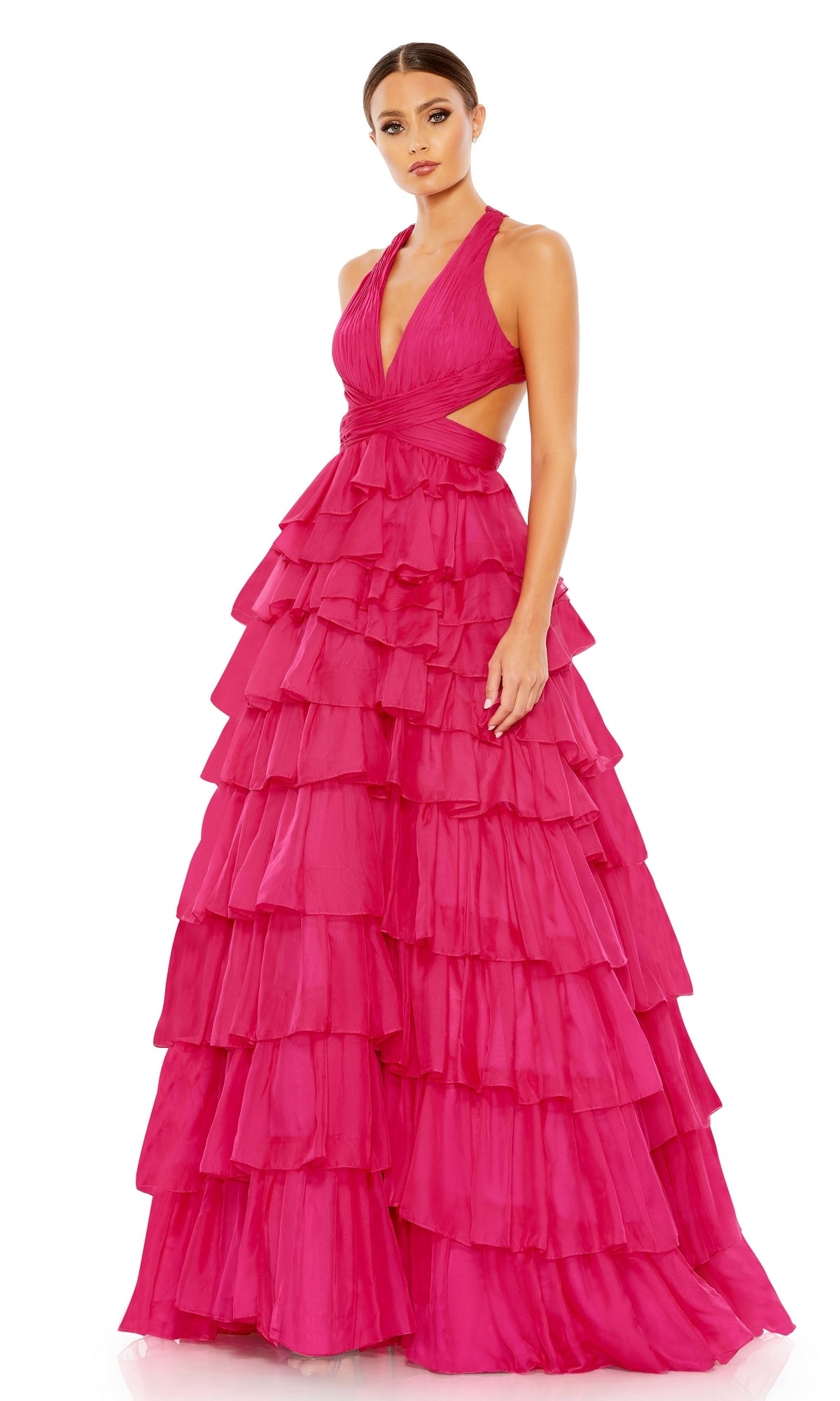 A woman stands facing forward against a white background wearing the Long Formal Dress 67988 by Mac Duggal—a bright pink a-line ball gown with multiple tiered ruffles.